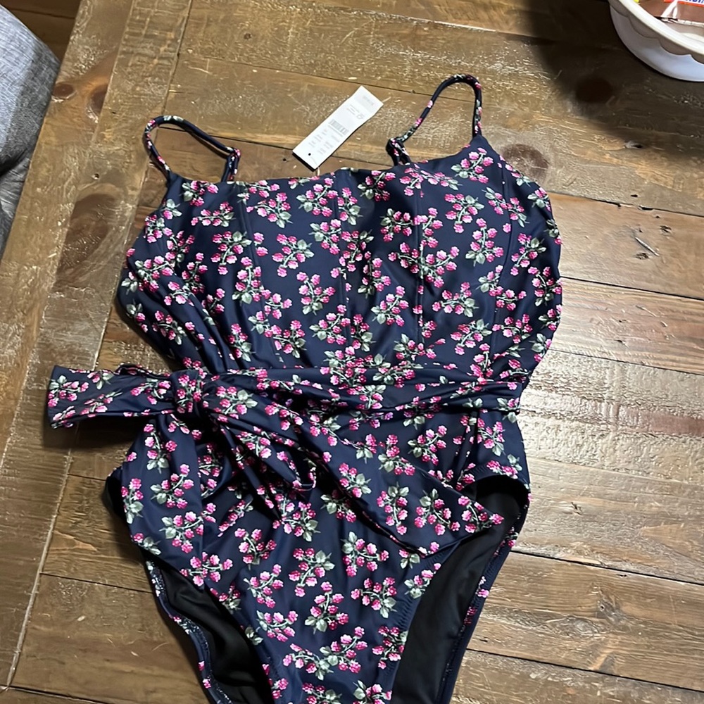 J Crew  size 10 one piece blue floral suit with a belted waist.